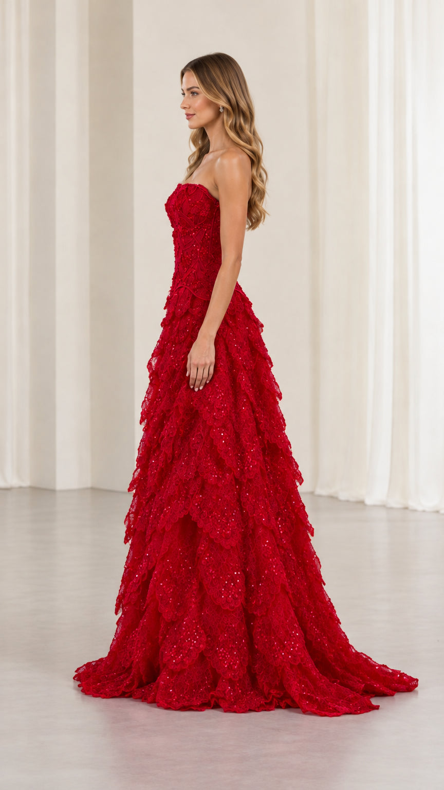 Side profile of red strapless sequin embroidered formal gown