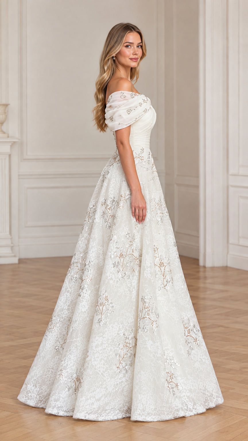 Side profile of model wearing ivory formal lace gown with ruched bodice