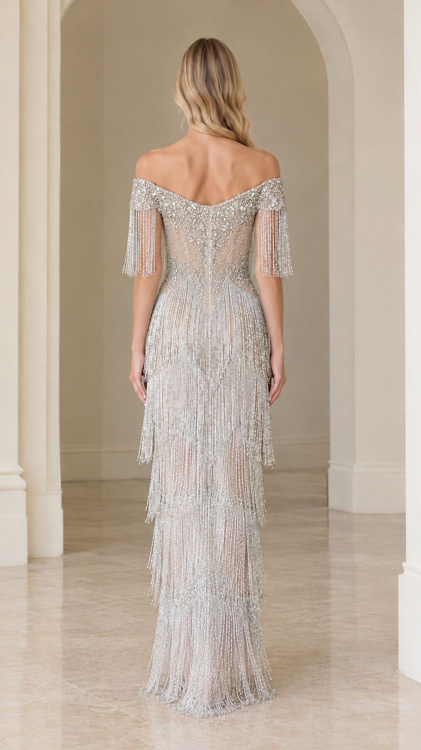 Back view of woman wearing silver beaded fringe maxi gown