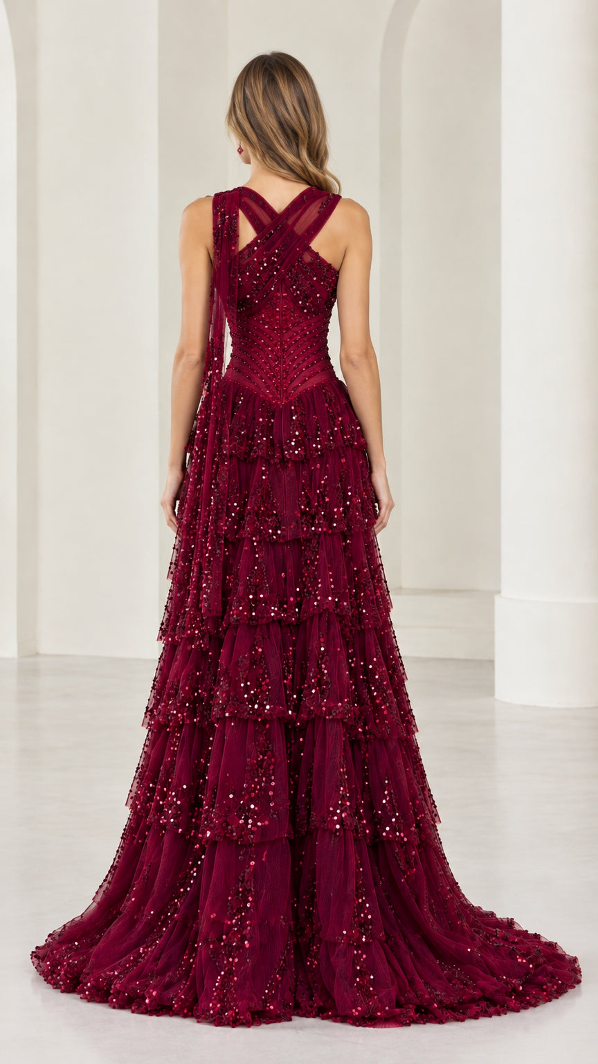 Back view of burgundy criss-cross halter formal gown showing train
