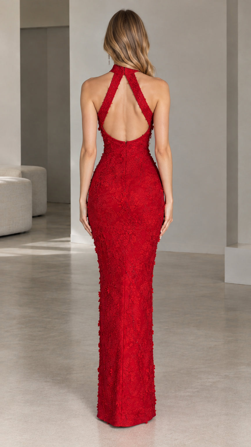 Back view showcasing open back cutout of red floral lace evening gown