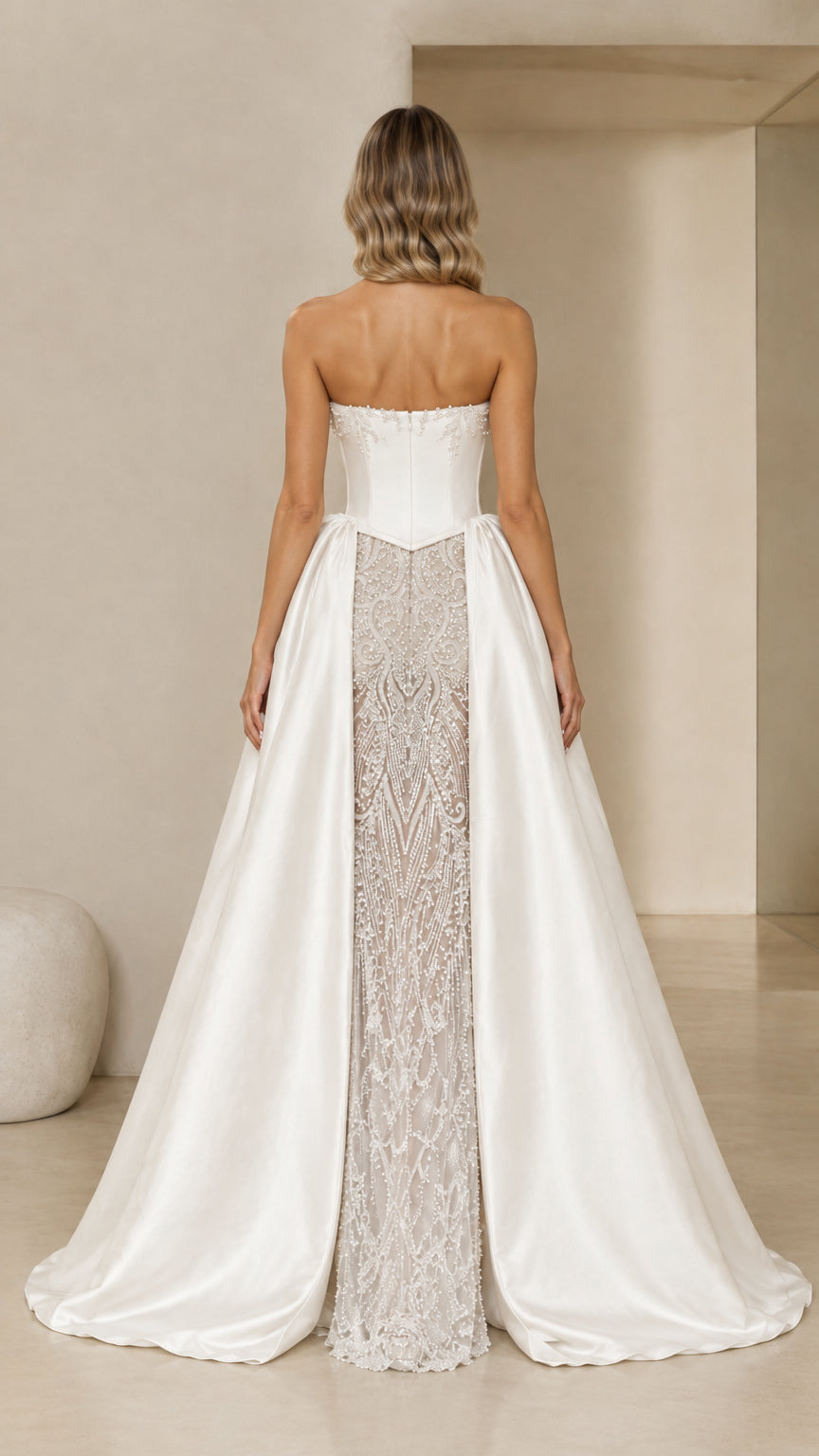 Back view of Ivory White corset formal gown showing train and satin drape