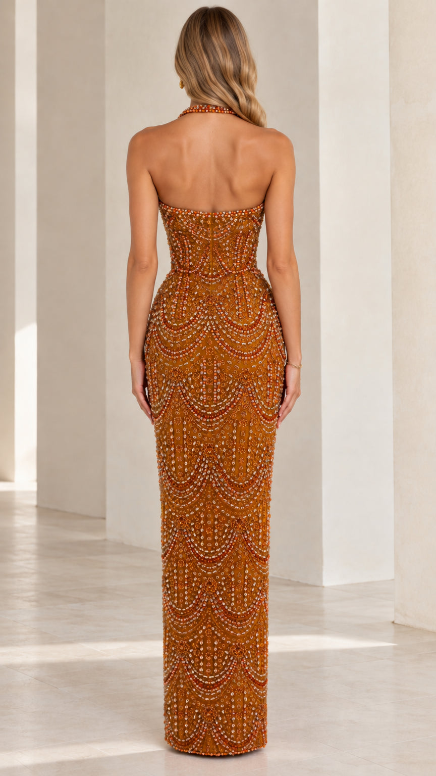 Back view of rust open back halter beaded evening gown