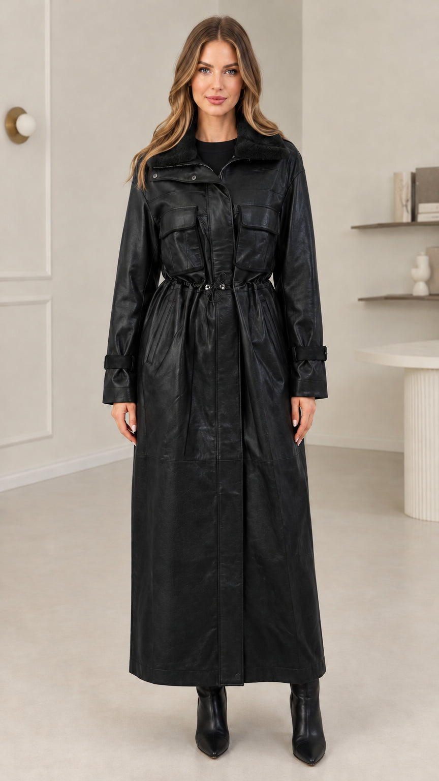 Full-length view of black faux leather maxi trench coat with adjustable waist