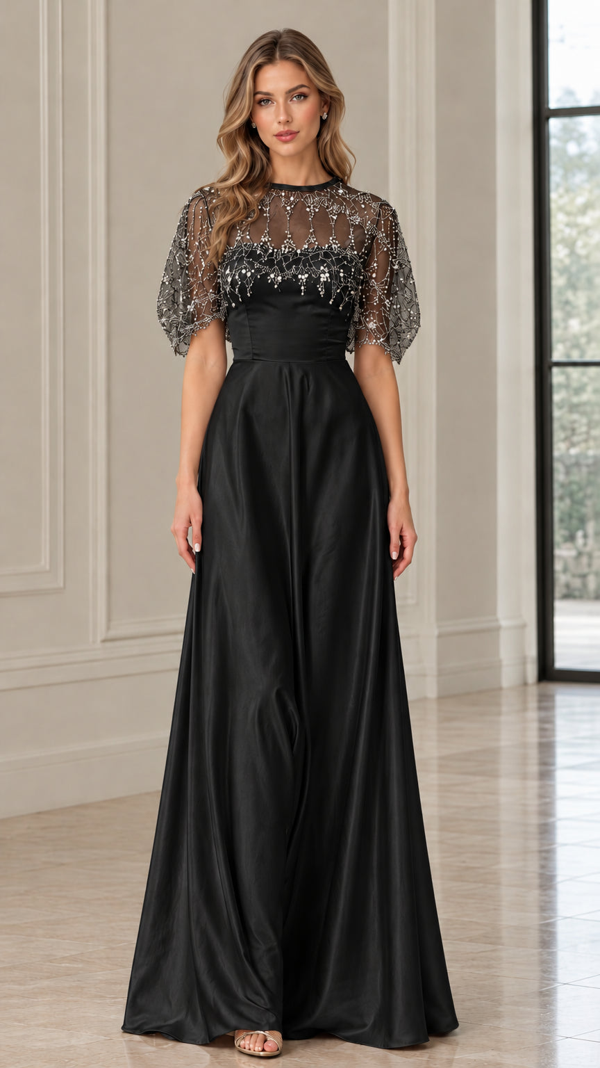 Front view of black beaded illusion capelet satin evening gown