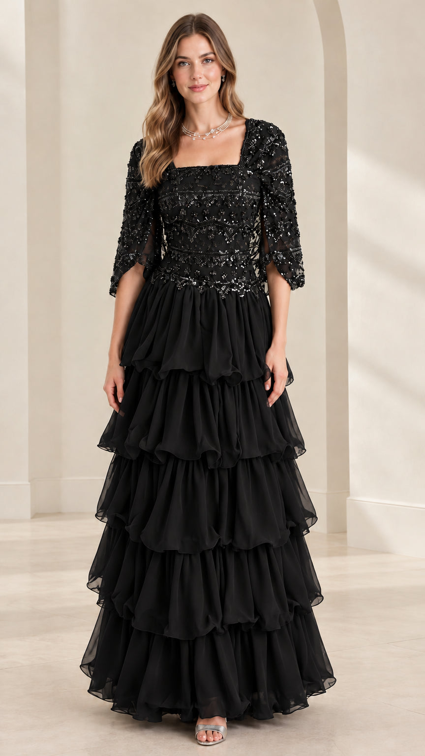 Full view of black sequin bodice tiered ruffle maxi formal evening gown