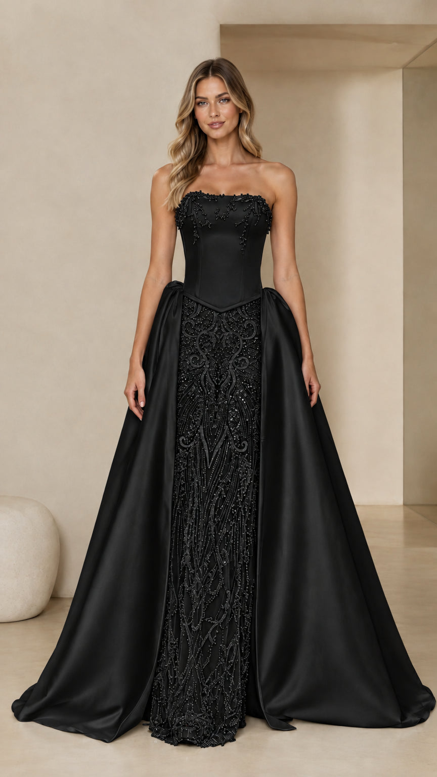 Front full view of Black strapless beaded corset gown with satin overskirt
