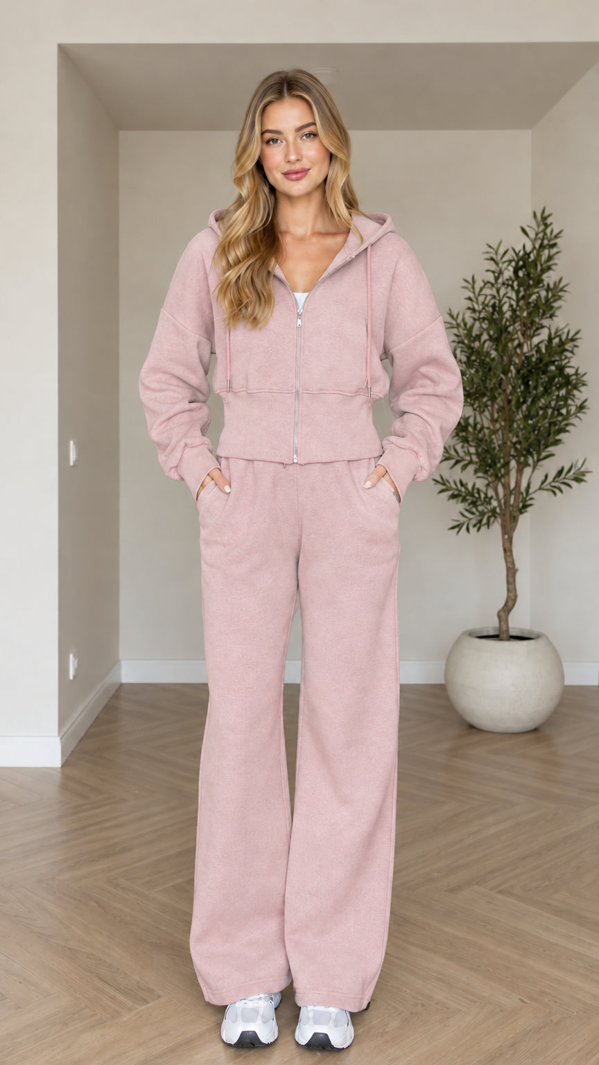 Front view of woman wearing dusty pink cropped zip hoodie and wide-leg sweatpants set