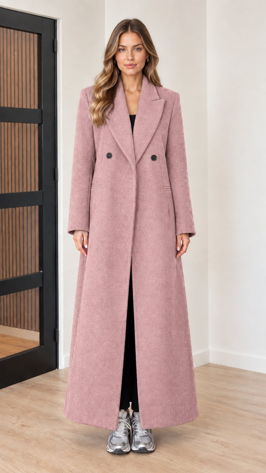 Front view of woman wearing dusty pink double-breasted maxi coat