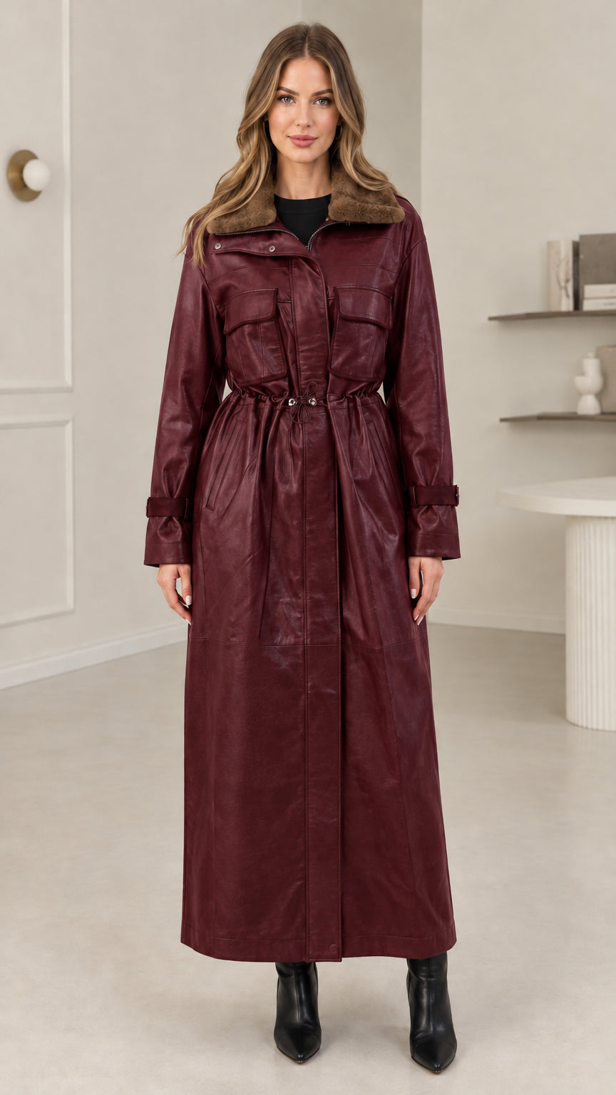 Full-length view of burgundy faux leather maxi trench coat with cinch waist