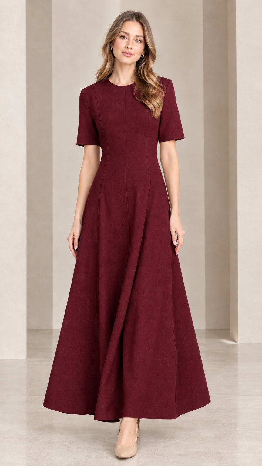 Front view of woman wearing rich burgundy short sleeve A-line maxi dress