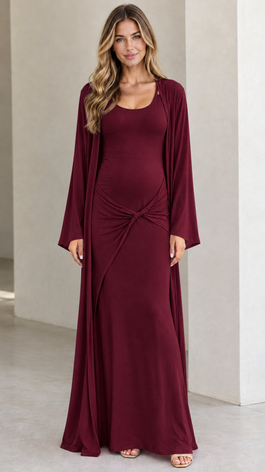 Front view of pregnant model wearing Burgundy maternity maxi dress and cardigan set