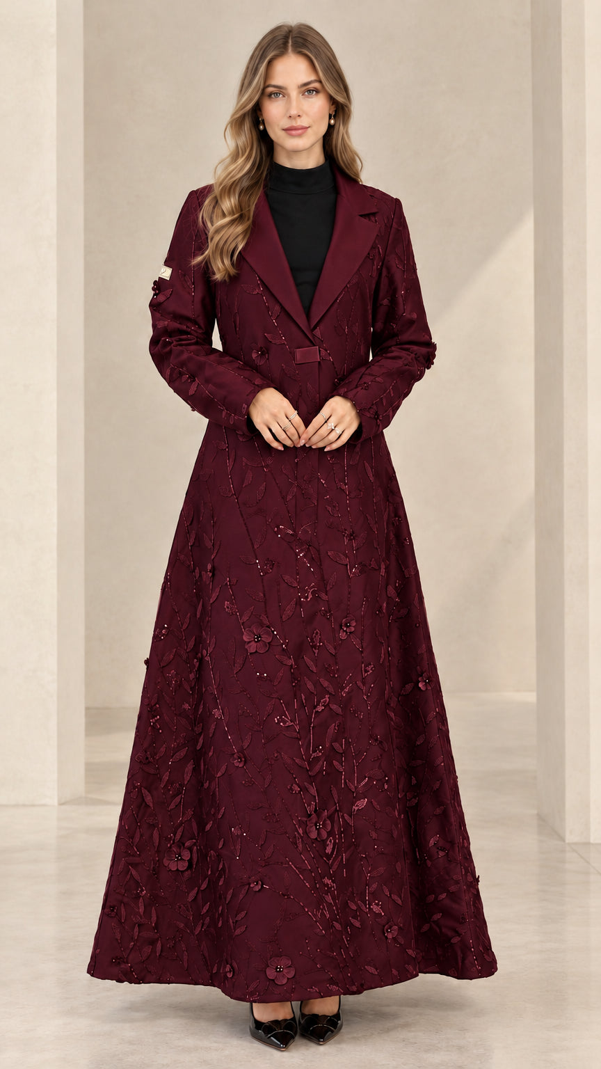 Front view of woman wearing burgundy floral sequin maxi evening coat