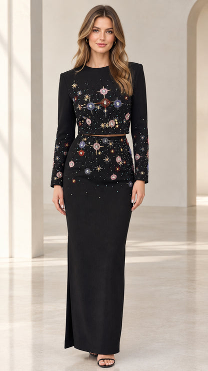 Front view of model wearing black beaded two-piece long sleeve maxi dress