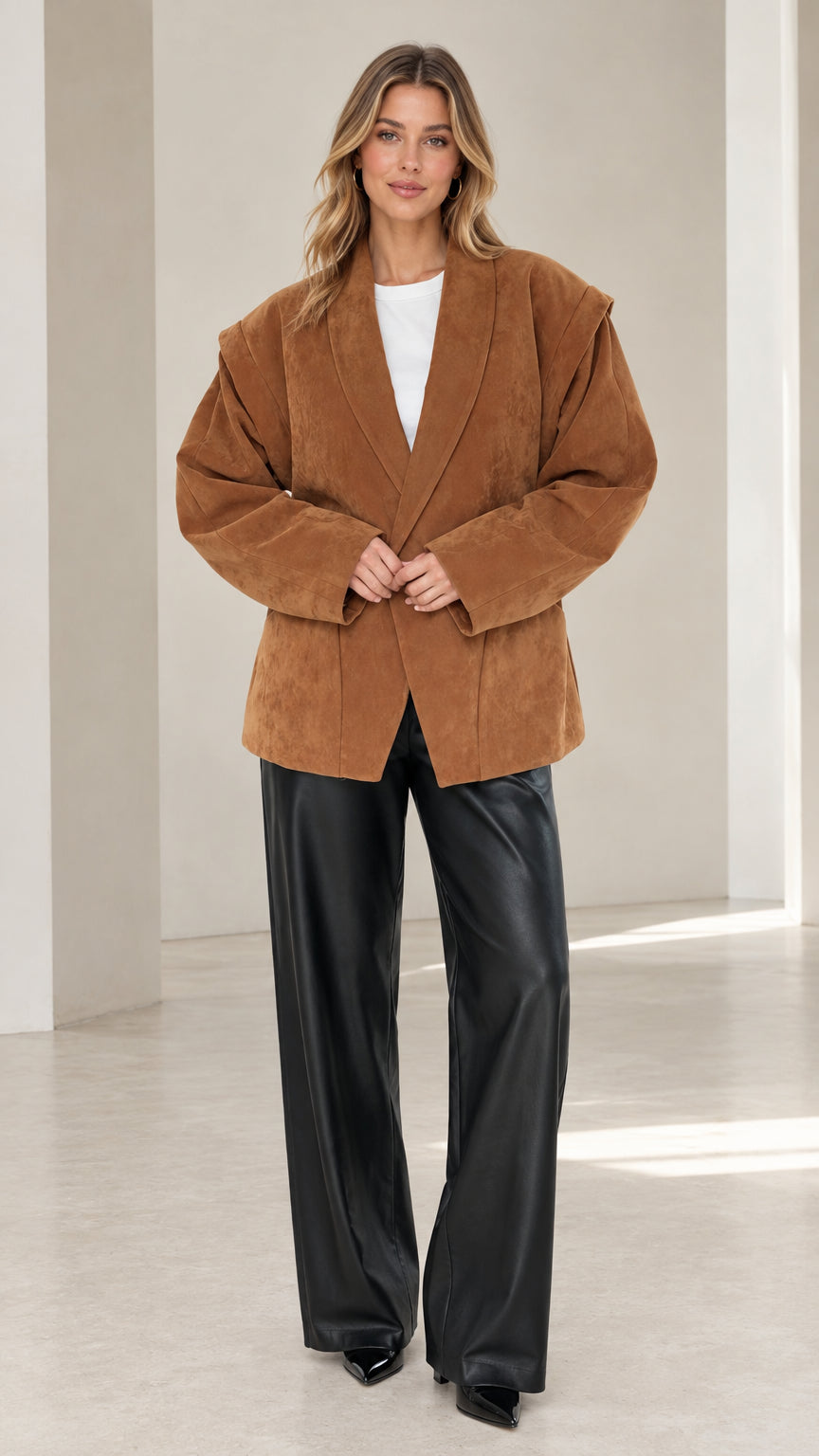 Full front view of model wearing camel faux suede oversized blazer with black leather trousers