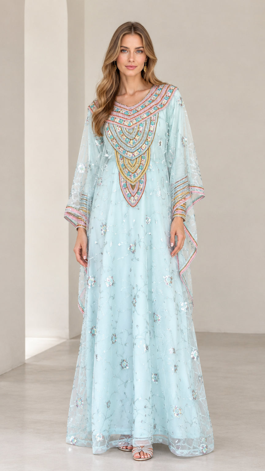 Front full-length view of woman wearing Light Blue embroidered kaftan maxi dress