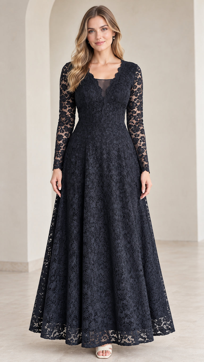 Front view of model wearing Navy Blue long sleeve lace maxi dress with scalloped V-neck