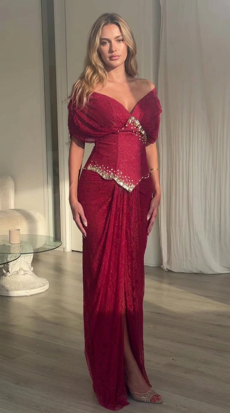Full front view of model wearing burgundy off-the-shoulder embellished basque waist maxi dress