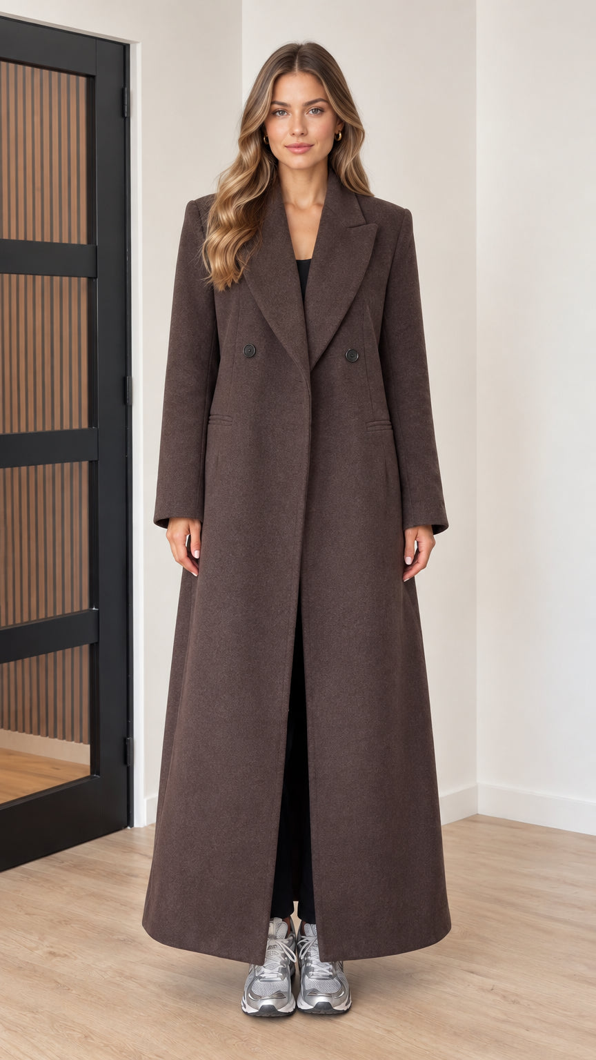 Front full view of woman wearing chocolate brown maxi tailored overcoat