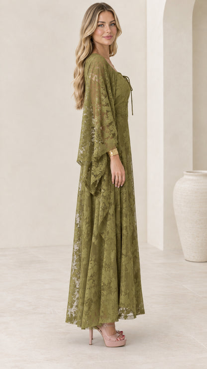 Side profile view of olive green lace maxi gown showing drape of sleeve and skirt