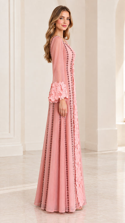 Side profile view of dusty pink maxi dress showing elegant silhouette and flared cuffs