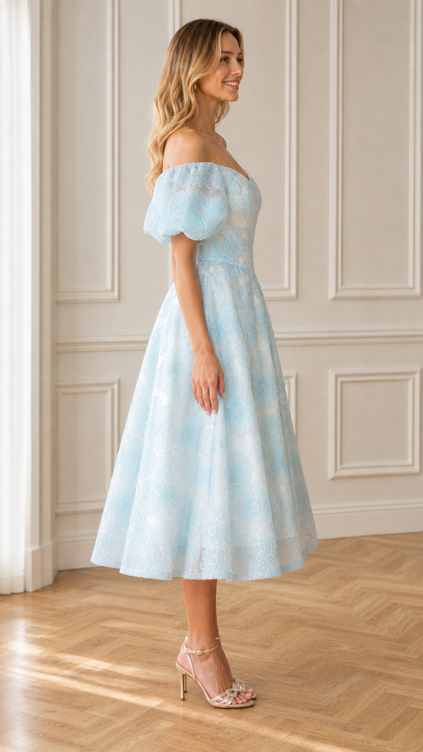 Side view of light blue midi dress with puff sleeves