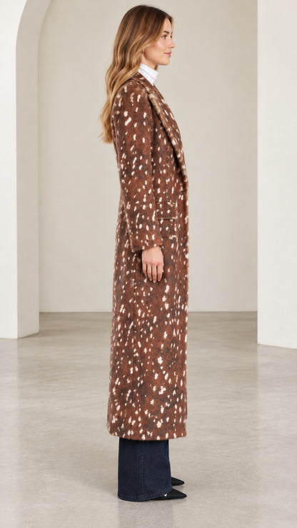 Side profile view of woman wearing brown speckled longline overcoat