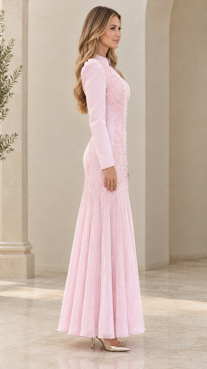 Side profile view of light pink long sleeve pleated maxi dress