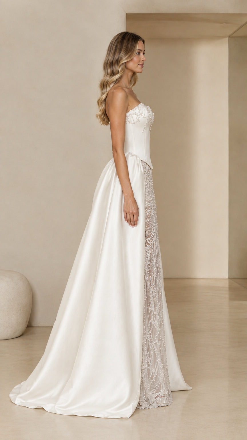 Side profile of Ivory White strapless ball gown with beaded front panel