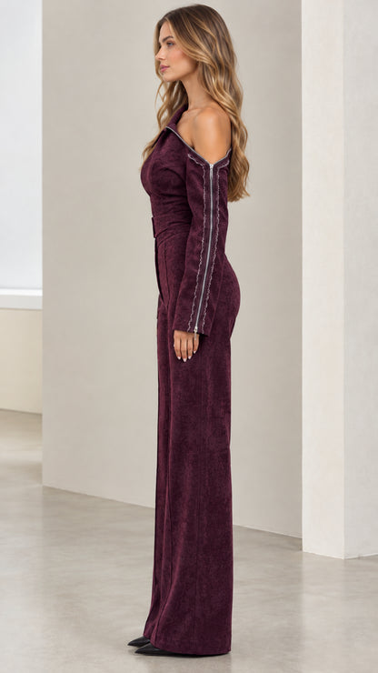 Side angle view of model in Burgundy textured one-shoulder wide-leg jumpsuit