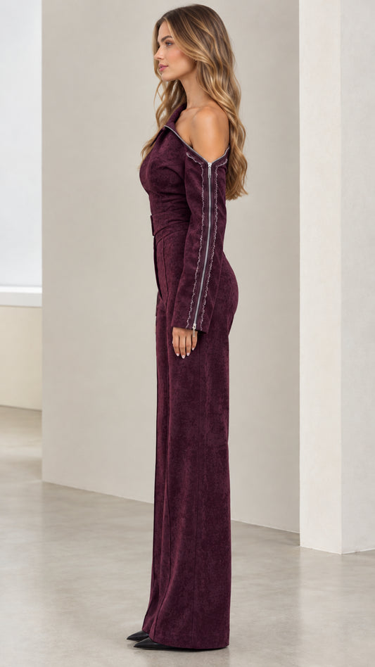 Side angle view of model in Burgundy textured one-shoulder wide-leg jumpsuit