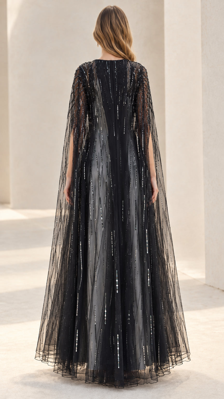 Back view of flowing black sequin tulle evening cape