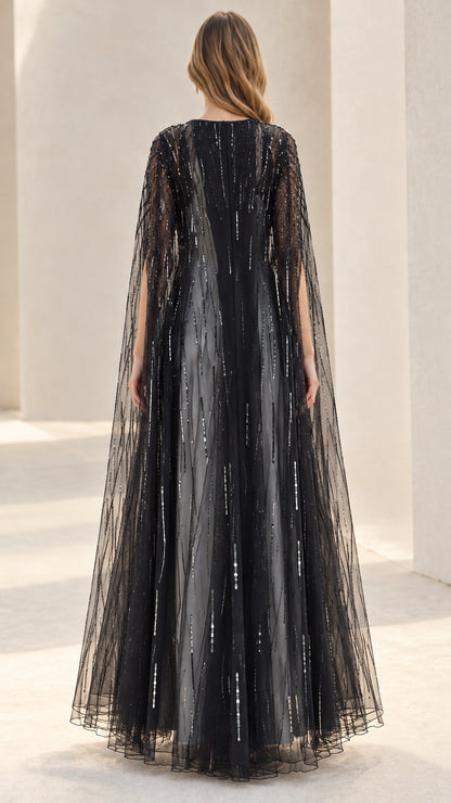 Back view of flowing black sequin tulle evening cape