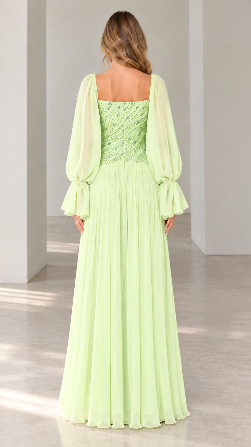Back view of mint green square neck formal gown showing flowing pleated skirt