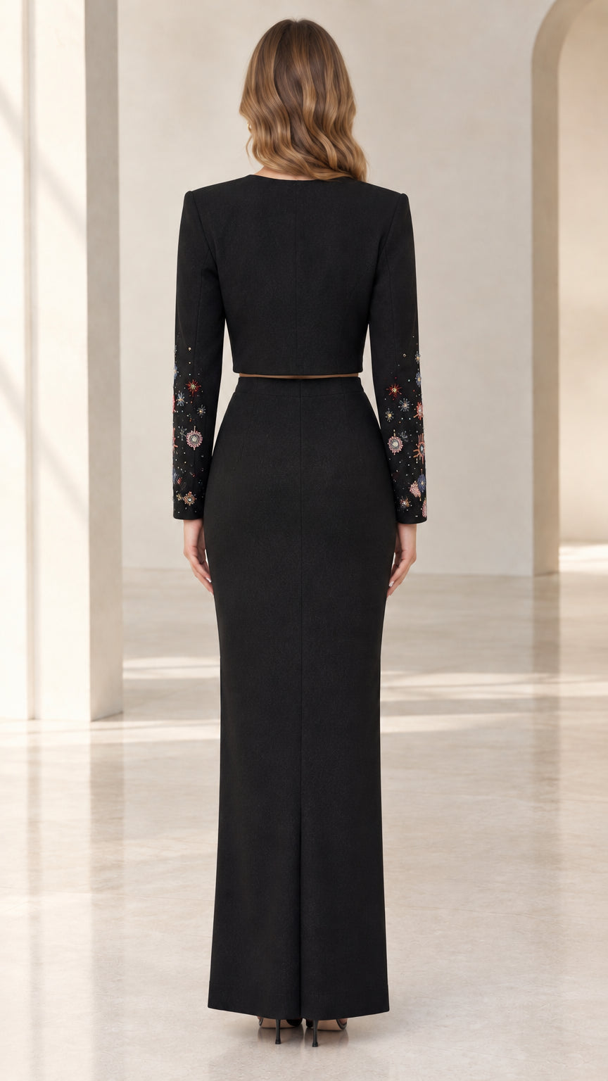 Back view of black column evening gown set with long sleeves