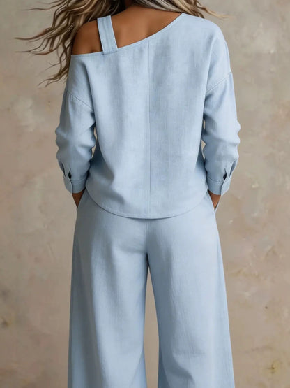 Back view of woman wearing light blue lounge set