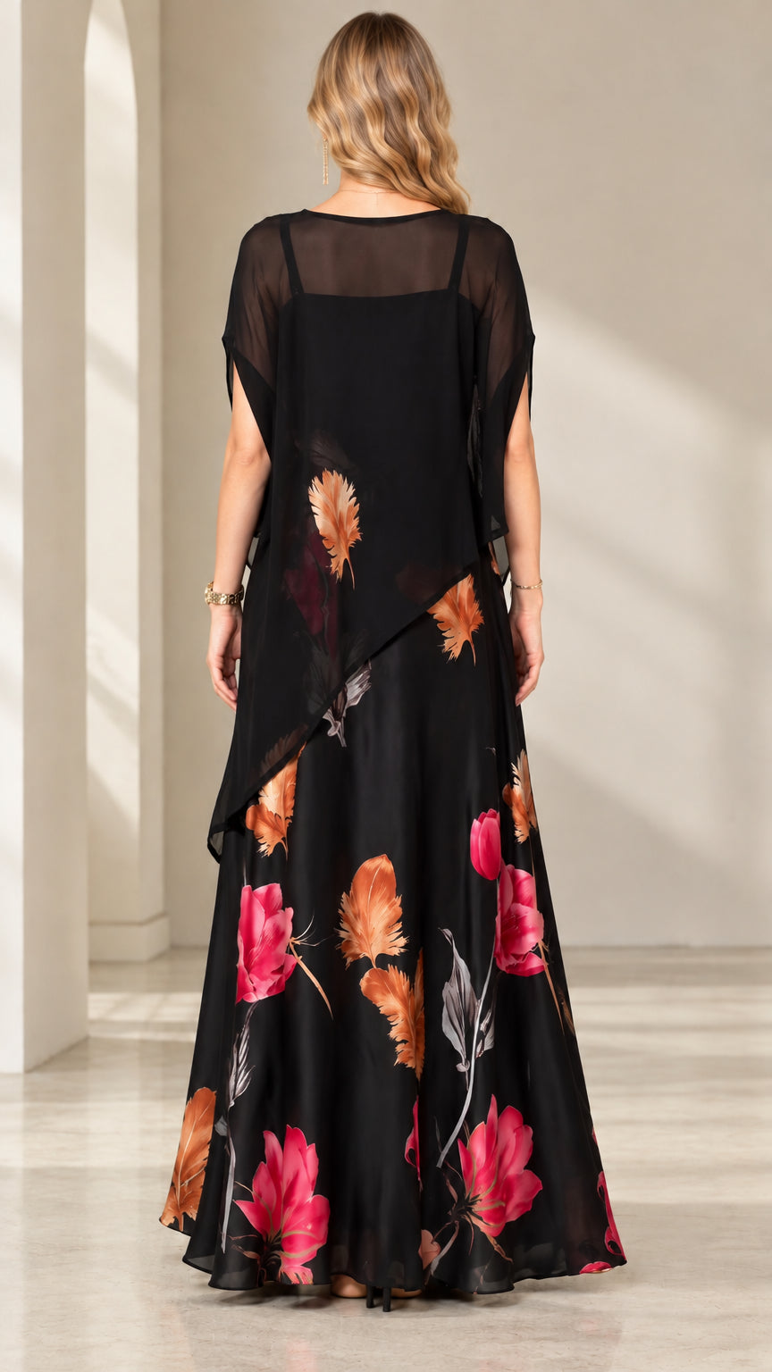 Back view of black chiffon capelet maxi dress with floral print
