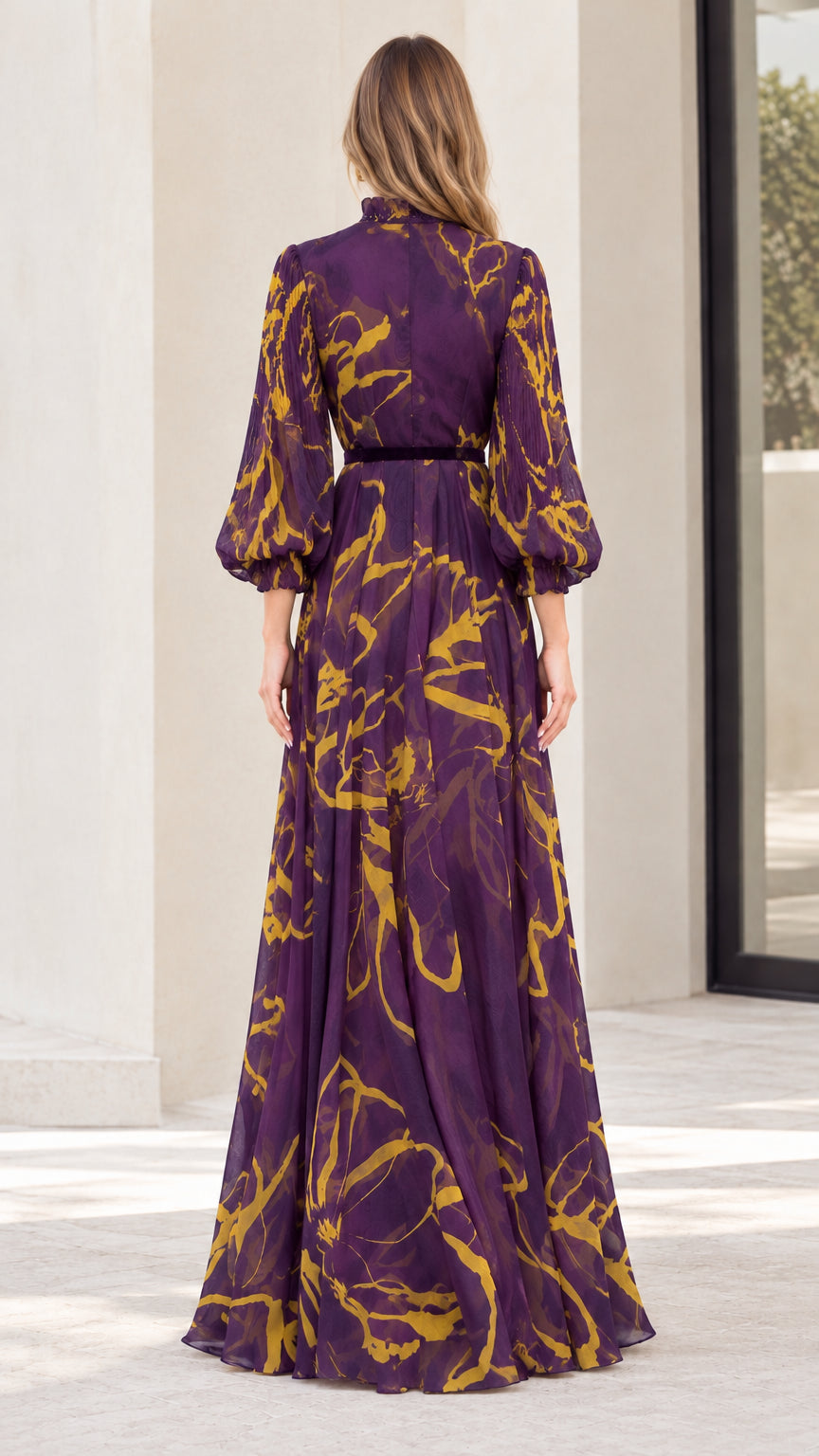 Back view of model wearing purple abstract print maxi dress with high neck