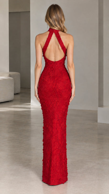 Back view showcasing open back cutout of red floral lace evening gown