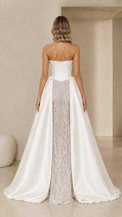 Back view of Ivory White corset formal gown showing train and satin drape