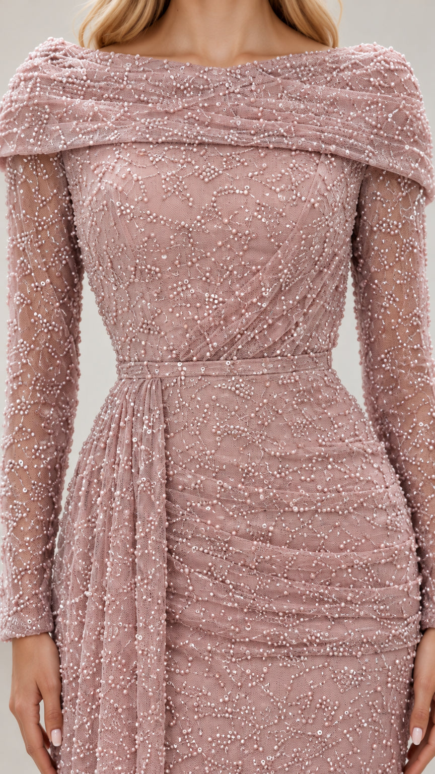 Close-up of intricate beadwork, ruched bodice, and folded neckline detail