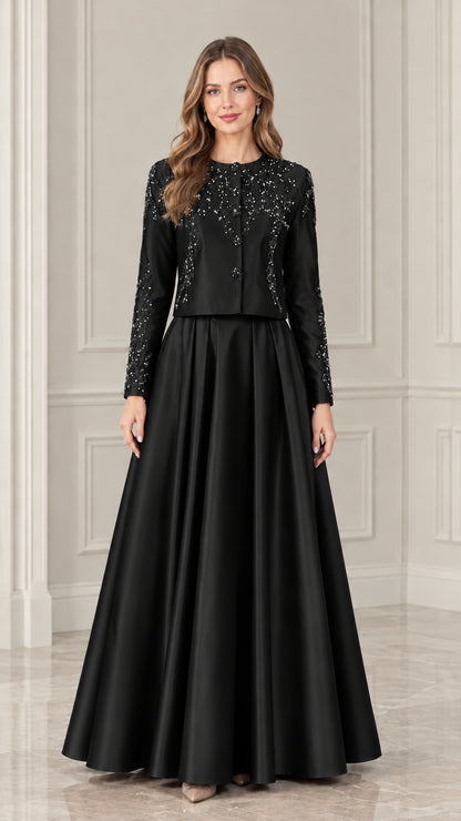 Model wearing black long sleeve beaded jacket and satin formal maxi dress set