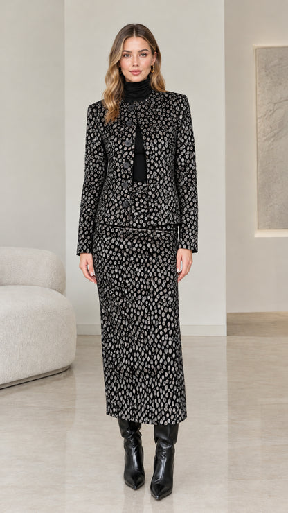 Model wearing Black and charcoal leopard print two-piece jacket and maxi skirt suit
