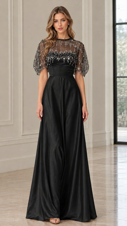 Front view of black beaded illusion capelet satin evening gown