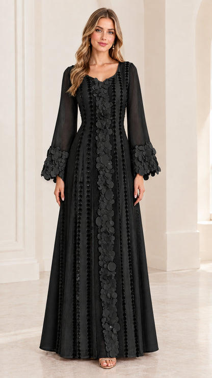 Full-length front view of black long sleeve evening dress with matching floral trim