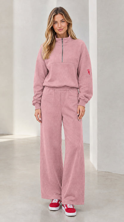 Front view of woman wearing dusty pink half-zip pullover and wide-leg lounge set
