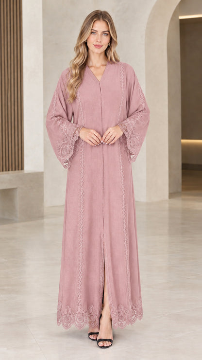 Front view of woman wearing dusty pink lace trim maxi abaya dress