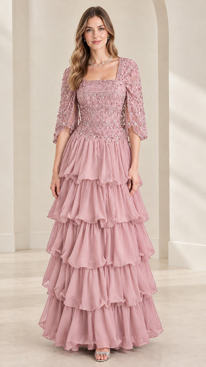 Full view of dusty rose pink sequin beaded tiered ruffle formal evening gown