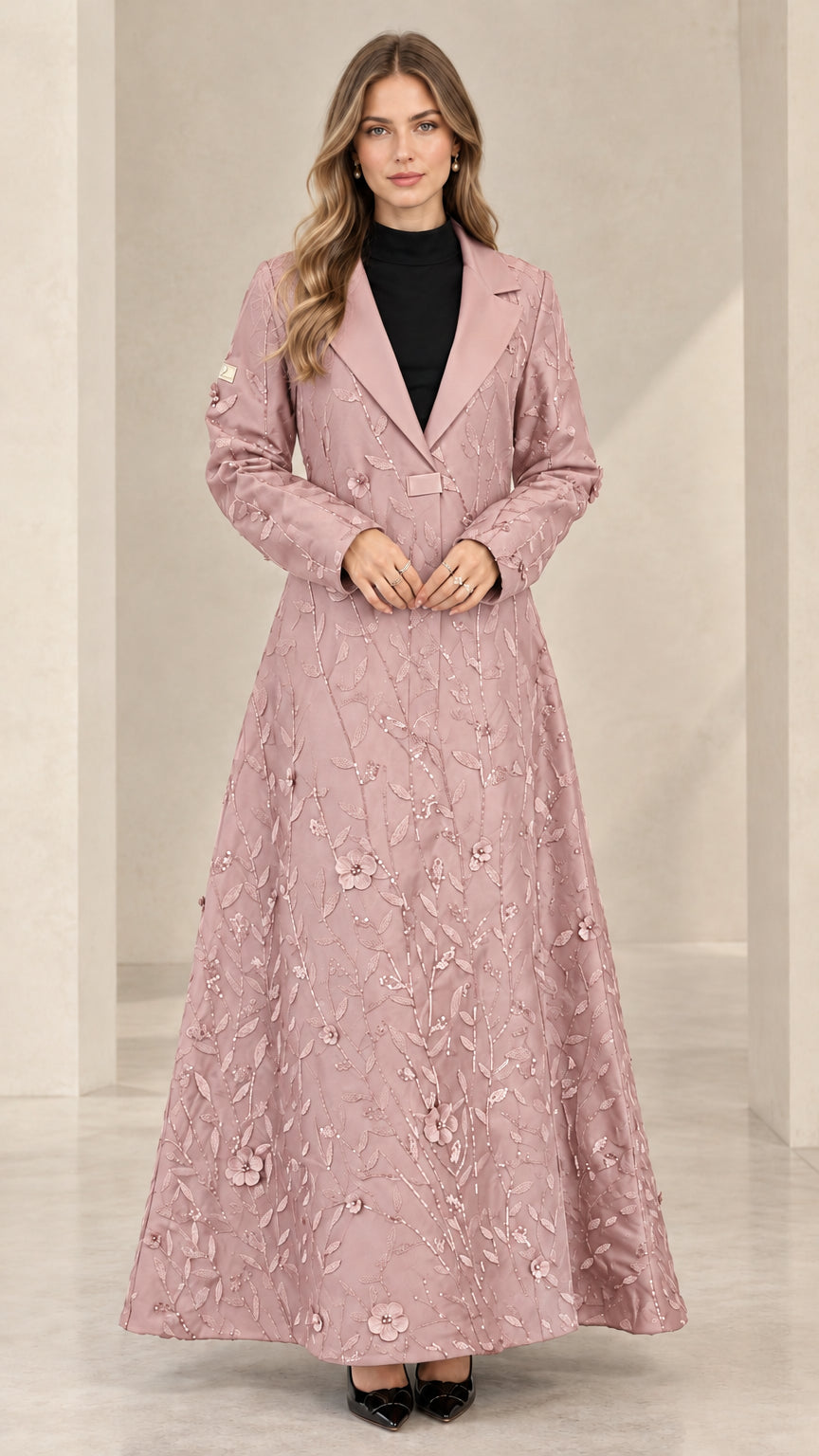 Front view of woman wearing dusty pink floral sequin maxi evening coat