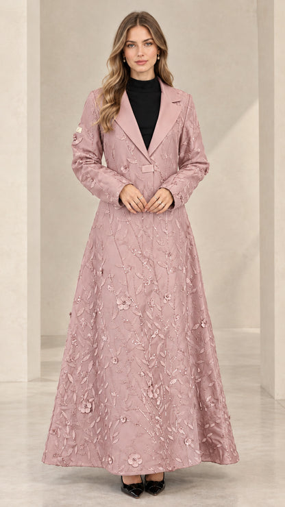 Front view of woman wearing dusty pink floral sequin maxi evening coat